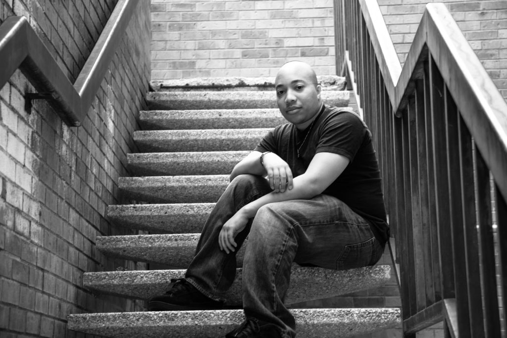 bald black man in stairwell