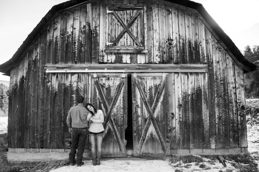 Romantic couple in front of a barn