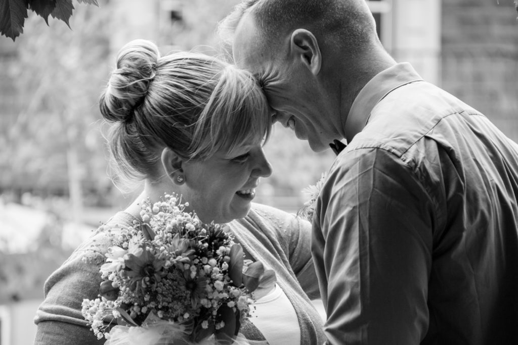 Elopement couple cuddling