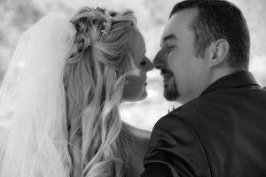 blond bride leaning in for a kiss from her groom in south fork, Colorado
