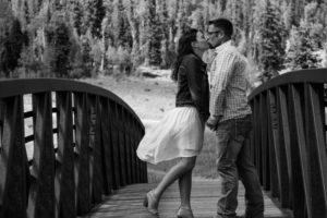 bride & groom kissing on a bridge in south fork, colorado